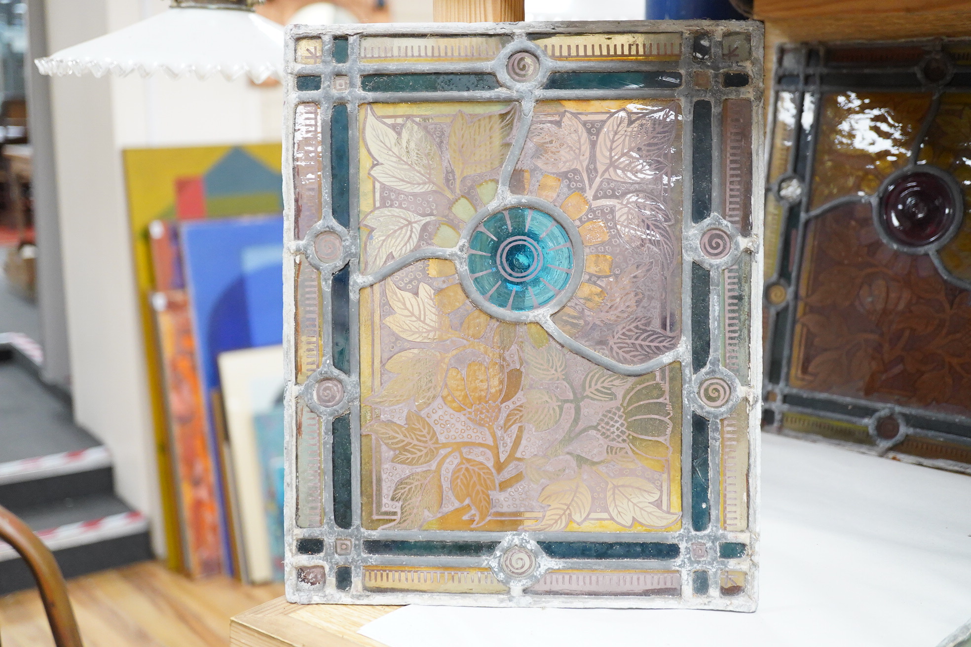 A set of eight late 19th century leaded stained glass panels, 23cm x 28cm